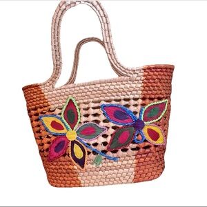 EUC woven straw tote bag with colorful butterfly and floral embroidery.